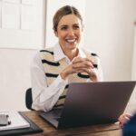 Female hiring manager interviewing a job candidate in her office